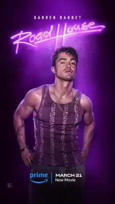 Darren Barnet poses as Sam in a vest with his hands on his waist for Road House.