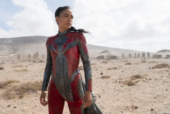 Lauren Ridloff as Makkari stands on a sandy surface in Marvel