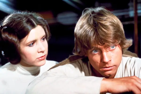 Carrie Fisher as Princess Leia Organa and Mark Hamill as Luke Skywalker in Star Wars Episode IV - A New Hope