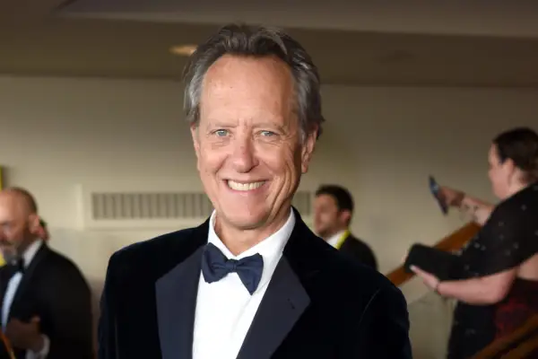 Richard E Grant wearing a tuxedo