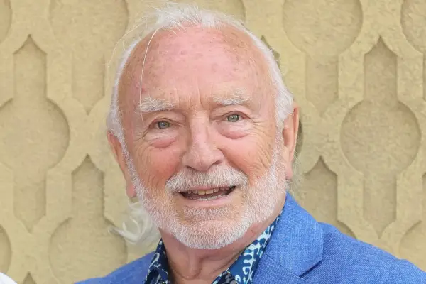 Paul Freeman in a blue linen suit