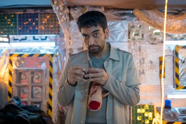 Nabhaan Rizwan in Film Club, with a prosthetic severed alien attached to his shirt as if it