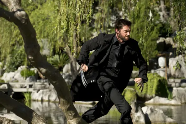 Hugh Jackman in The Wolverine, in a black suit and running