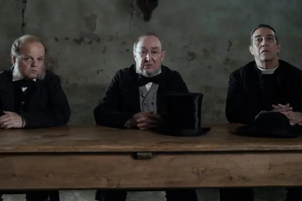 The Wonder. (L to R) Toby Jones as Dr. McBrearty, Dermot Crowley as Sir Otway, Ciarán Hinds as Father Thaddeus in The Wonder. Cr. Aidan Monaghan/Netflix © 2022