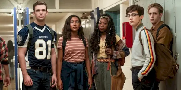 Friend group standing in corridor in There