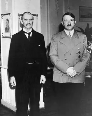German Fuhrer Adolf Hitler (1889-1945) (R) and British prime minister Neville Chamberlain (1869-1940) standing together at Bad Godesberg, Germany. Hitler wears a swastika armband. (Photo by Hulton Archive/Getty Images)
