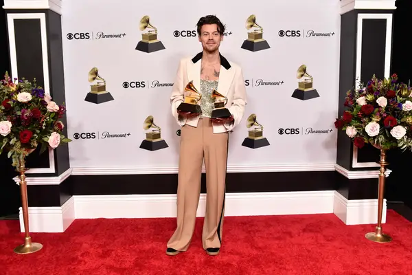 Harry Styles poses with the Best Pop Vocal Album Award for Harry’s House and Album of the Year Award for Harry’s House in the press room during the 65th GRAMMY Awards at Crypto.com Arena on February 05, 2023, in Los Angeles, California. (Photo by Alberto E. Rodriguez/Getty Images for The Recording Academy)