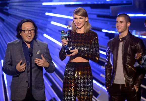 Director Joseph Kahn (L) and recording artist Taylor Swift accept the Best Female Video award for 