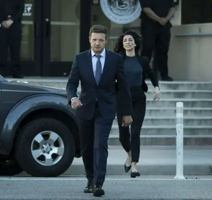 Jeremy Renner as Mike McLusky and Necar Zadegan as Evelyn in a still from 