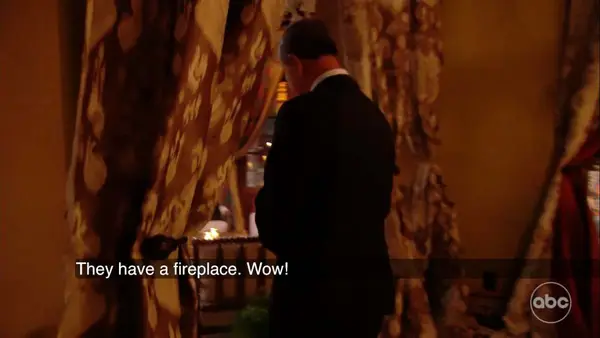 Charles L admiring the fireplace at 