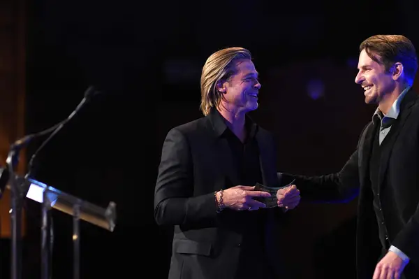 Brad Pitt accepts the award for Best Supporting Actor for Once Upon A Time... In Hollywood from Bradley Cooper onstage during The National Board of Review Annual Awards Gala at Cipriani 42nd Street on January 08, 2020, in New York City. (Photo by Jamie McCarthy/Getty Images for National Board of Review)