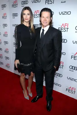 HOLLYWOOD, CA - NOVEMBER 17: Actor Mark Wahlberg (R) and wife Rhea Durham attend the premiere of 
