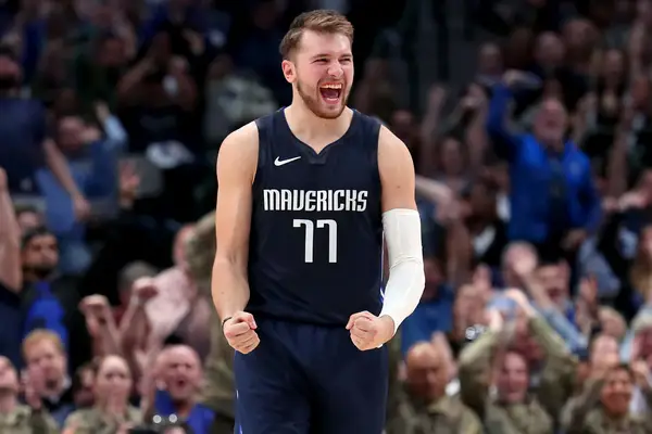 DALLAS, TEXAS - NOVEMBER 06: Luka Doncic #77 of the Dallas Mavericks celebrates after the Dallas Mav