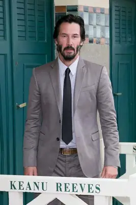 Actor Keanu Reeves poses next to the beach closet dedicated to him during a photocall on September 4, 2015 in Deauville, France. (Photo by Marc Piasecki/Getty Images)