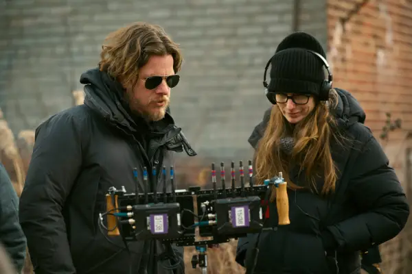 Fallout Executive Producer and Director Jonathan Nolan, Showrunner and Executive Producer Geneva Robertson-Dworet standing together and watching something back on a camera