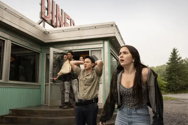 The cast of From season 2 looking scared as they spot something off-screen