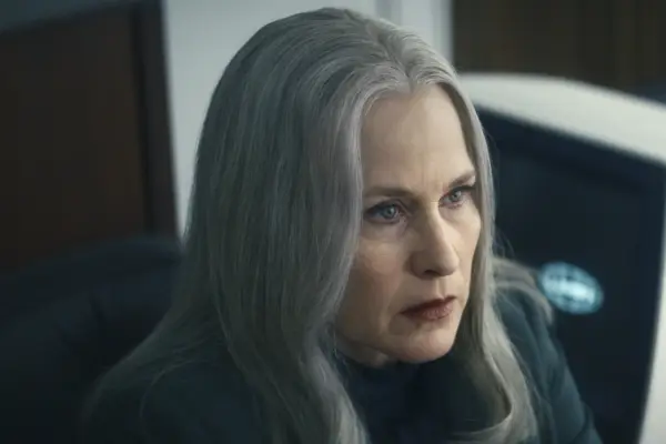 Adam Scott as Mark in Severance walking with a blazer on his shoulder