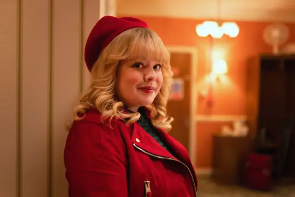Nicola Coughlan in Doctor Who wearing red jacket and hat