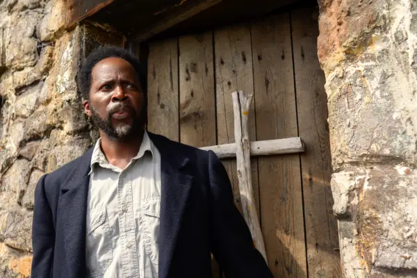 Harold Perrineau in From season 2, wearing a black suit jacket and grey shirt