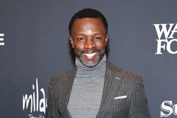 Sean Patrick Thomas wearing a grey suit