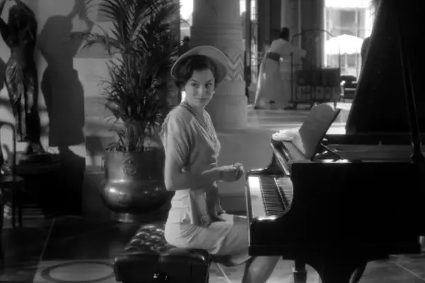 Emma Corrin in Black Mirror season 7 at a piano