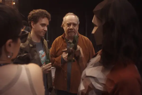 Peter Capaldi in Black Mirror season 7, sat at a table