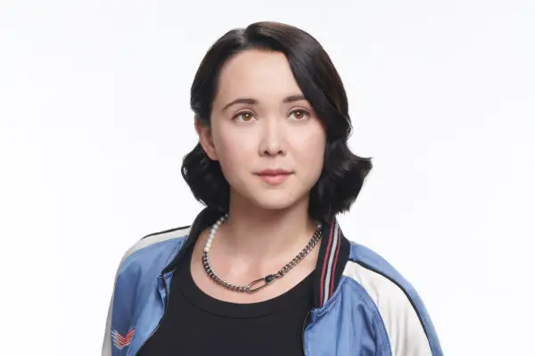 London Thor as Jordan Li in Gen V wearing a blue and white jacket