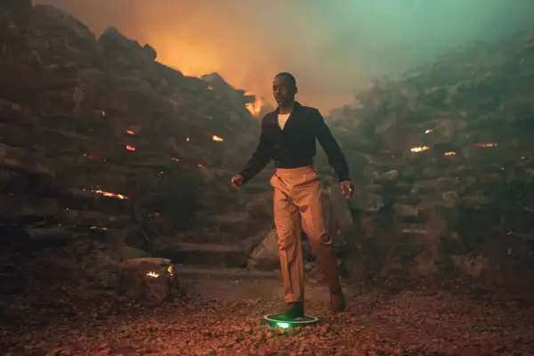 Ncuti Gatwa in Doctor Who standing on a green landmine looking shocked