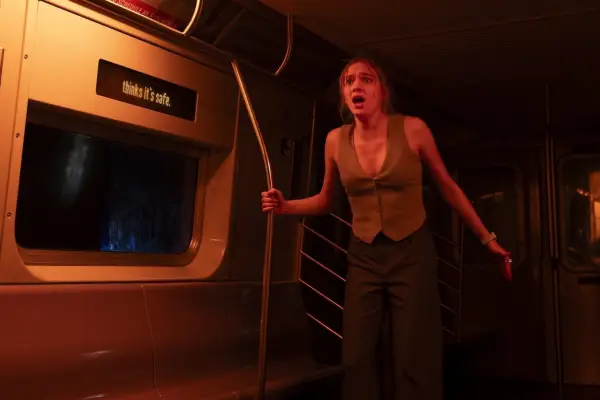 Jayden Bartels as Cece in Goosebumps: The Vanishing, looking shocked as she walks through a dark tunnel.