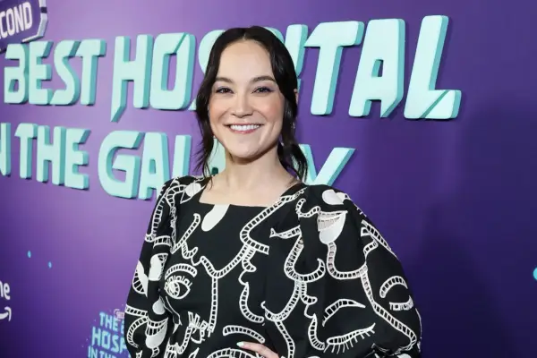 Cirocco Dunlap wears a black and white dress at the premiere of The Second Best Hospital in the Galaxy