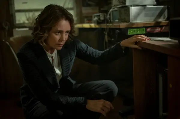 Keeley Hawes in Orphan Black: Echoes in a pinstripe suit looking at something