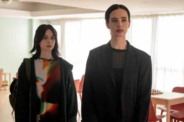 Krysten Ritter as Lucy, Amanda Fix as Jules in Orphan Black: Echoes standing next to each other, looking stern