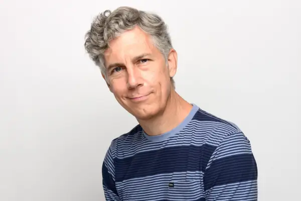 Chris Parnell in a stripy blue shirt