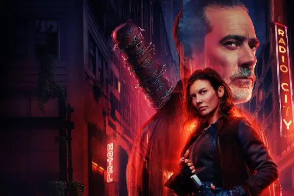 Jeffrey Dean Morgan as Negan and Lauren Cohan as Maggie in The Walking Dead: Dead City season 2 key art. Maggie stands in the foreground, holding a knife at her waist, dressed in dark tactical gear, with a determined expression and shoulder-length tousled hair. Behind her, a large, semi-transparent image of Negan looms, with a serious gaze and grey-streaked beard, holding his iconic barbed-wire-wrapped baseball bat. The background features a dark, abandoned city street illuminated by red neon signs reading HOTEL and RADIO CITY.