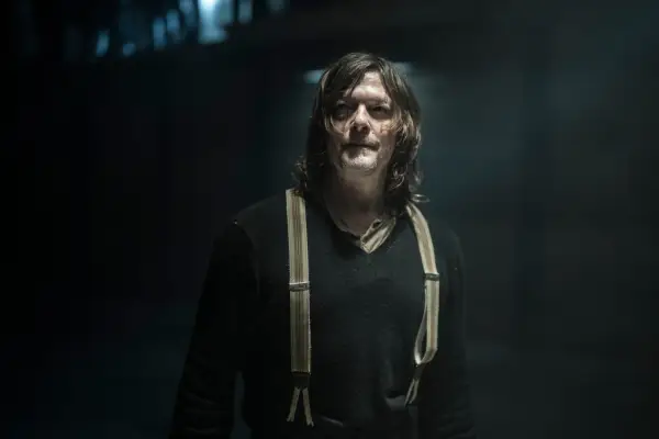 Norman Reedus as Daryl Dixon in The Walking Dead: Daryl Dixon in a black top and brown suspenders
