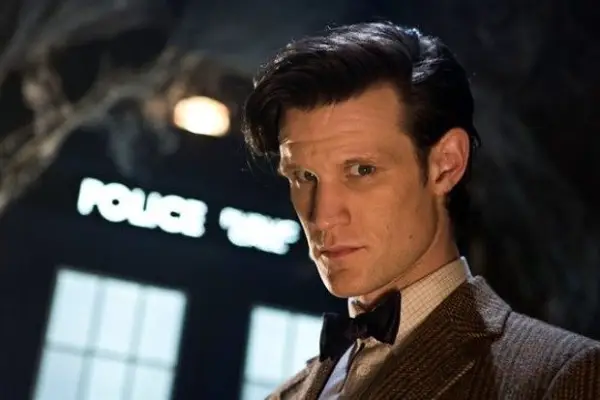 Matt Smith in Doctor Who as The Doctor, standing in front of the TARDIS.