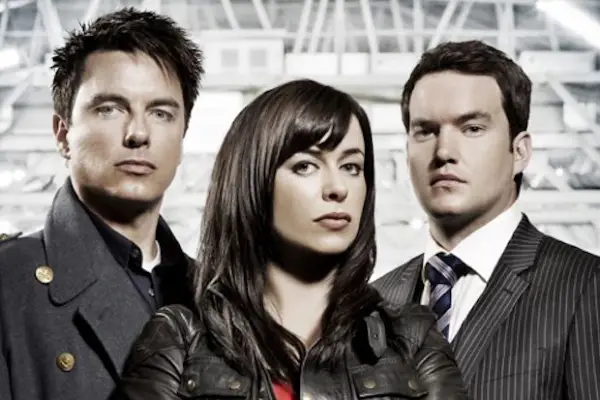 Torchwood characters stood together looking into camera
