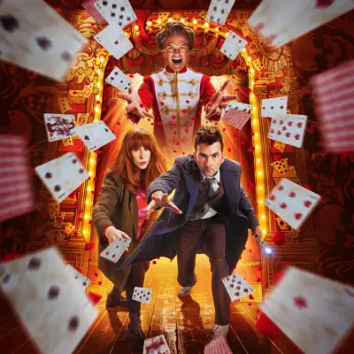 Key poster for ‘The Giggle’ featuring David Tennant as the Doctor, Catherine Tate as Donna Noble and Neil Patrick Harris as the Toymaker. He is looming over the Doctor and Donna, smiling maniacally and throwing playing cards towards the foreground.
