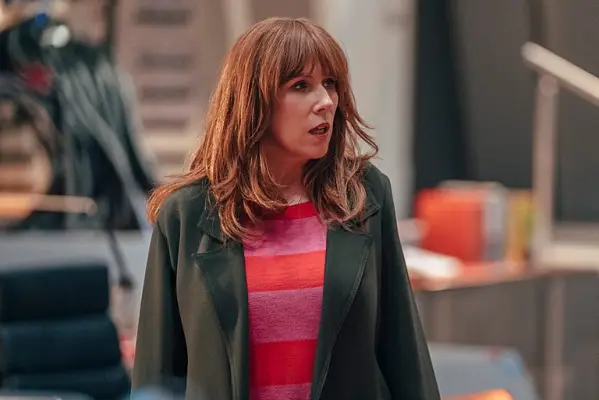 Donna (Catherine Tate) in Doctor Who wearing a pink jumper and olive coat