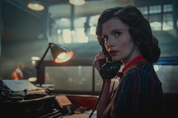 Emily Barber as Kathleen in Bodies, holding a phone to her ear