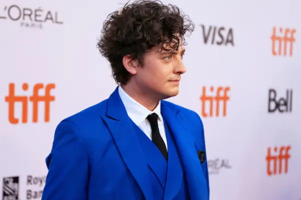 Aneurin Barnard wearing a blue suit
