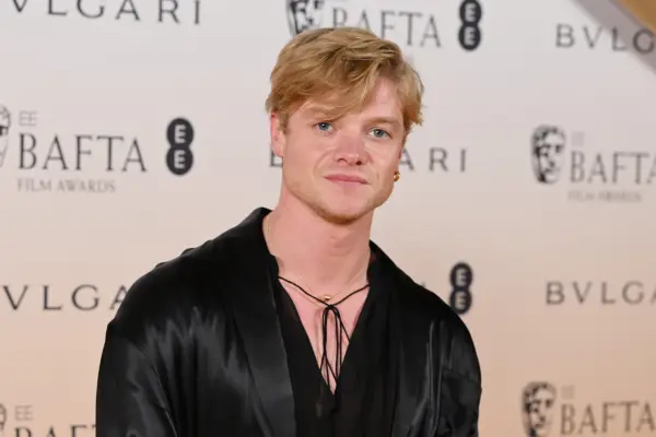 Tom Rhys Harries ay a BAFTA event looking at the camera