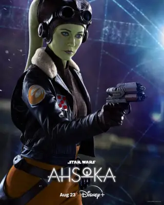 Mary Elizabeth Winstead as General Hera Syndulla pointing a blaster gun to the right of the image for Ahsoka.