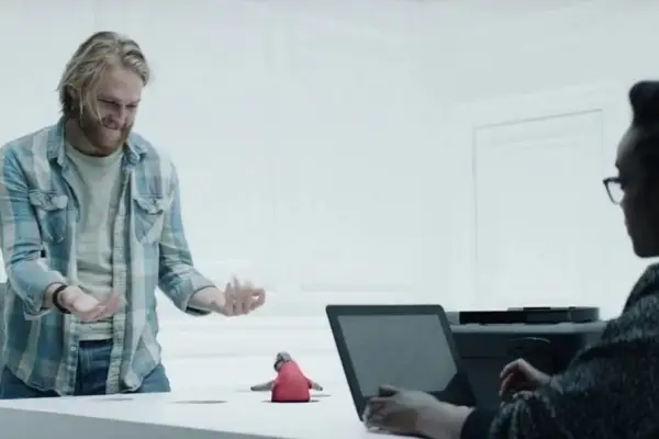 Peter Capaldi in Black Mirror season 7, sat at a table