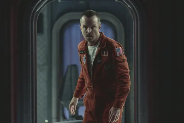 Aaron Paul in Black Mirror season 6, wearing a space suit