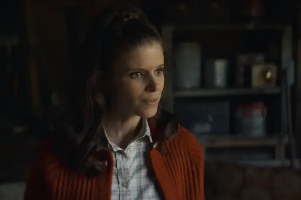 Kate Mara in a red cardigan and chequered shirt
