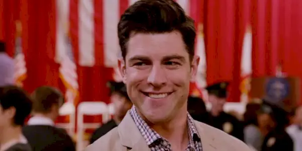 Max Greenfield smiling as Schmidt in New Girl