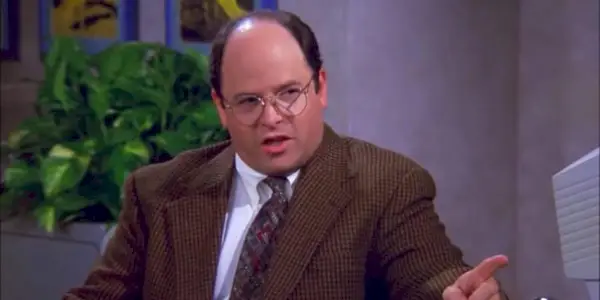 Jason Alexander speaking to someone off camera in Seinfeld
