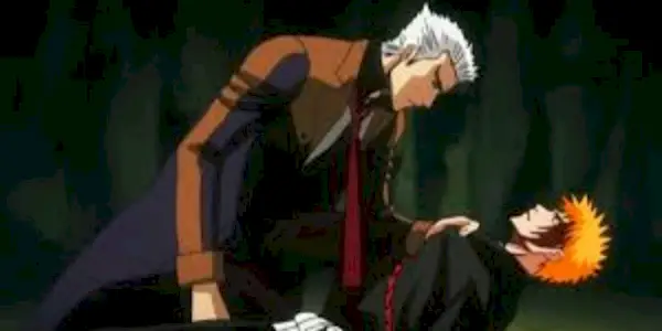 White haired man holding Ichigo in Bleach