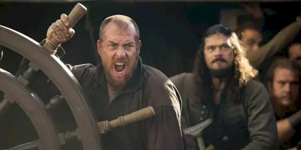 Captain Flint in Black Sails sailing a ship
